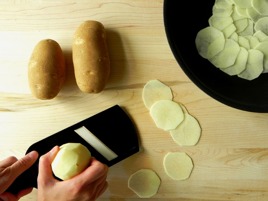 Slicing Potatoes Thinly with a Mandoline (c)2011 LaDomestique.com Slicing Potatoes Thinly with a Mandoline (c)2011 LaDomestique.com